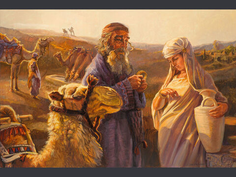 Eliezer i Rebeka.<br/>„A gdy wielbłądy się napiły, wyjął on złoty kolczyk ważący pół sykla i dwie bransolety na ręce, ważące dziesięć złotych sykli” (Rodzaju 24:22)<br/>Pełny tekst: Rodzaju 24:1–66 – Slajd 7